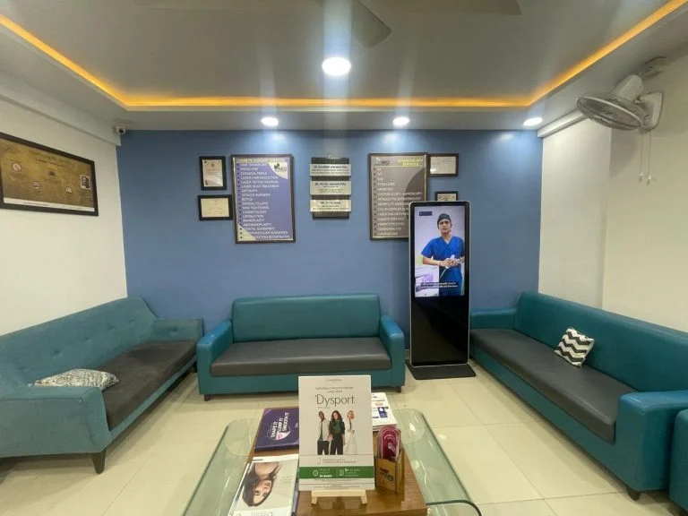 Waiting area at Neo Fertility Clinic, with the doctor's qualifications framed on the wall