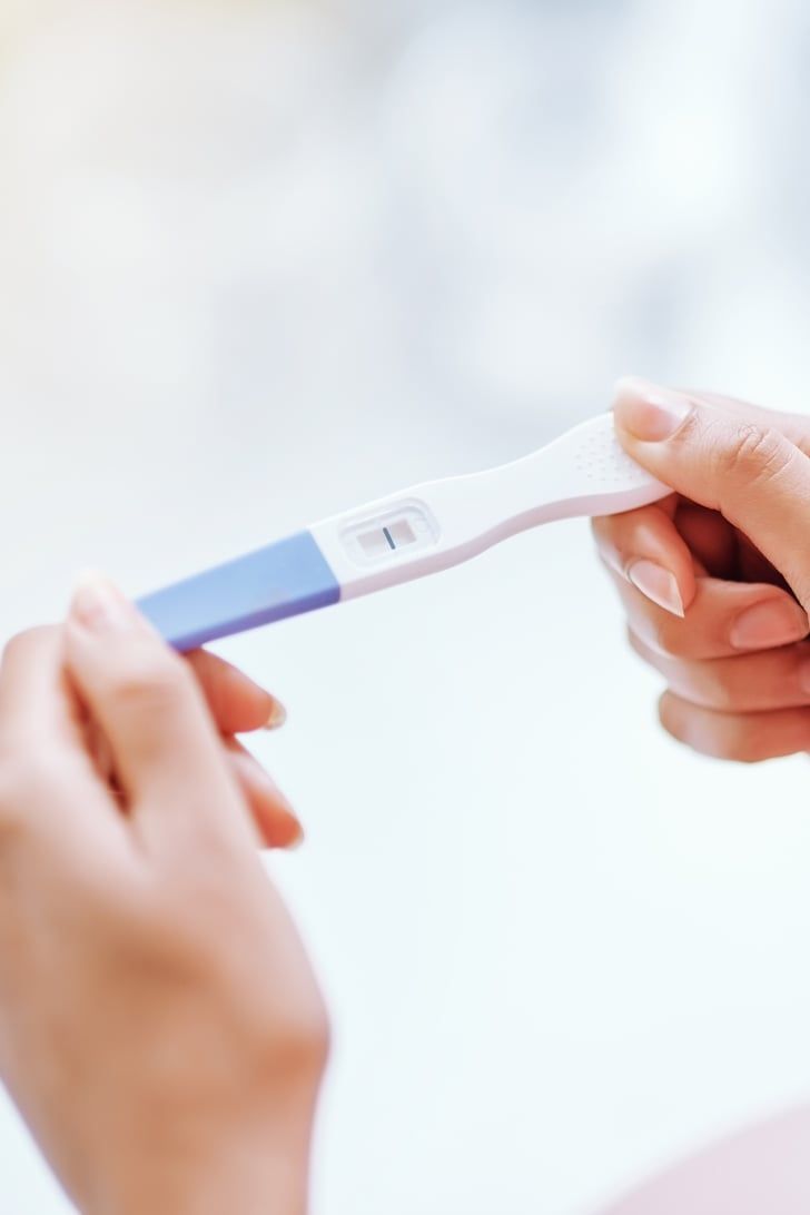 Hands holding a home pregnancy test