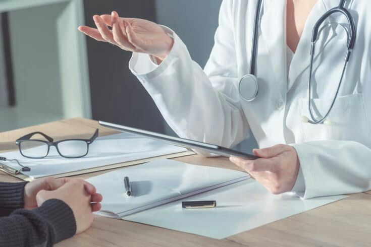 Doctor explaining a treatment plan to a patient