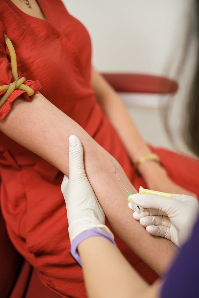 Baseline blood test being taken at a first antenatal visit
